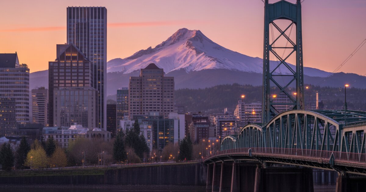 Portland, Oregon skyline at dusk with Mount Hood and the Willamette River