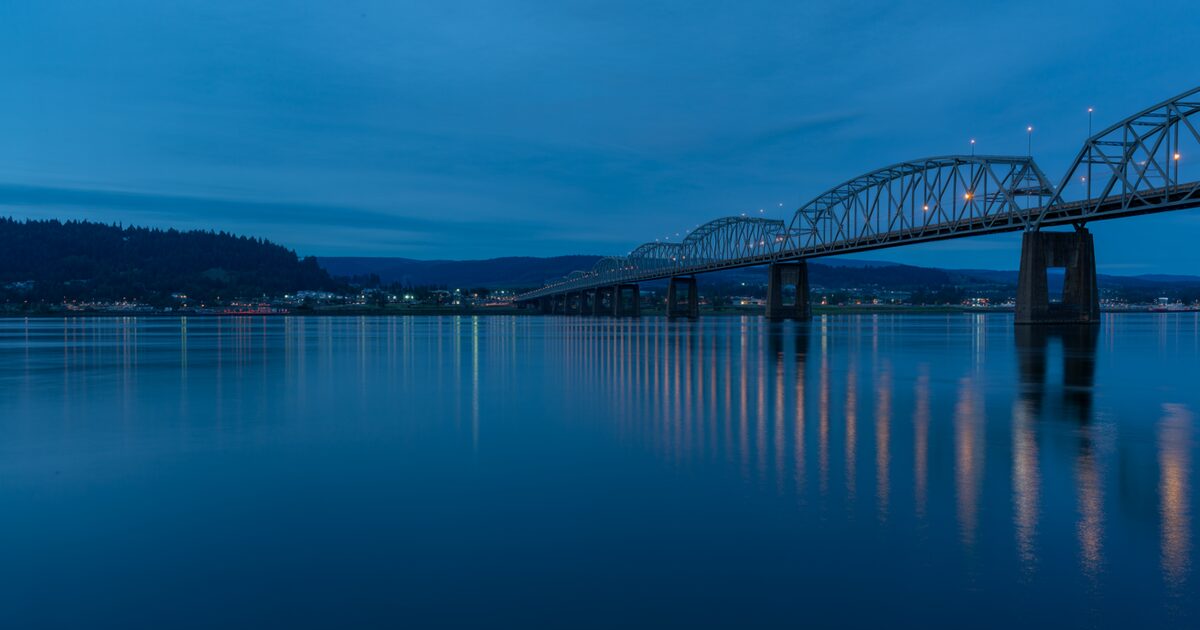 The Columbia River at dusk with the interstate bridge connecting Oregon and Washington