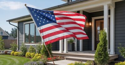 American flag displayed on the front porch of a brand-new construction home in Oregon